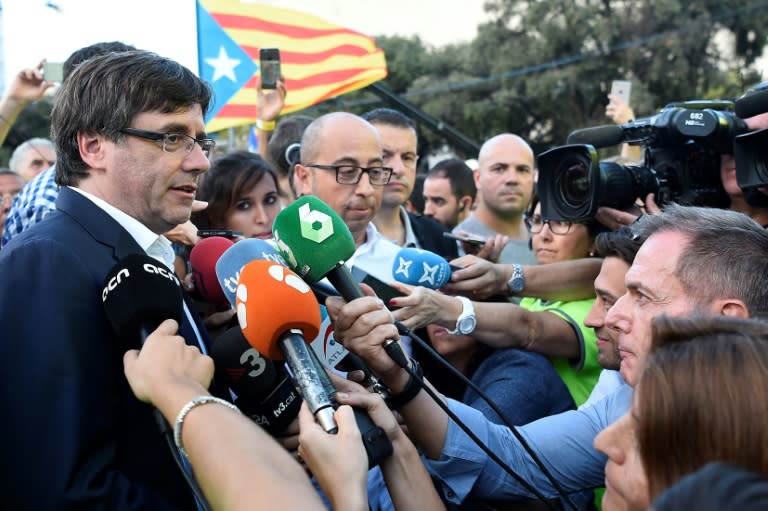 Current regional president Carles Puigdemont, seen attending a pro-independence demonstration in Barcelona, has been pushing hard for a yes vote since taking office early last year