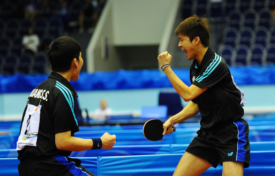 江宏傑與黃聖盛一同摘下2013年喀山世大運男雙金牌。（大專體總提供）