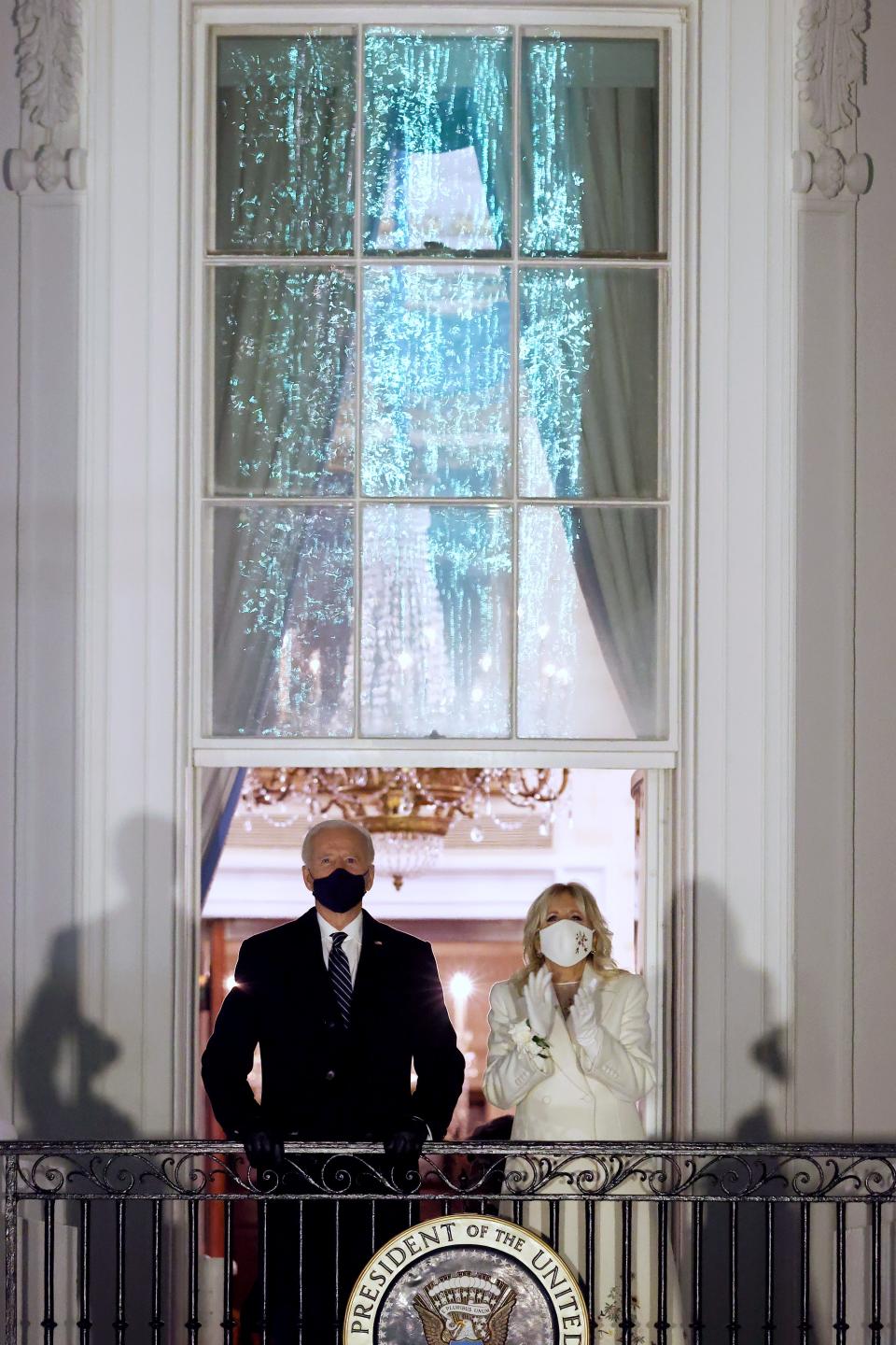 U.S. President Joe Biden and First Lady Dr. Jill Biden watch fireworks at the White House on January 20, 2021 in Washington, DC.  Biden became the 46th president of the United States earlier today during the ceremony at the U.S. Capitol.