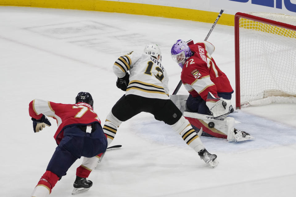 Florida Panthers goaltender Sergei Bobrovsky (72) stops a shot by Boston Bruins center Charlie Coyle (13) during the first period of an NHL hockey game, Wednesday, Nov. 22, 2023, in Sunrise, Fla. (AP Photo/Marta Lavandier)