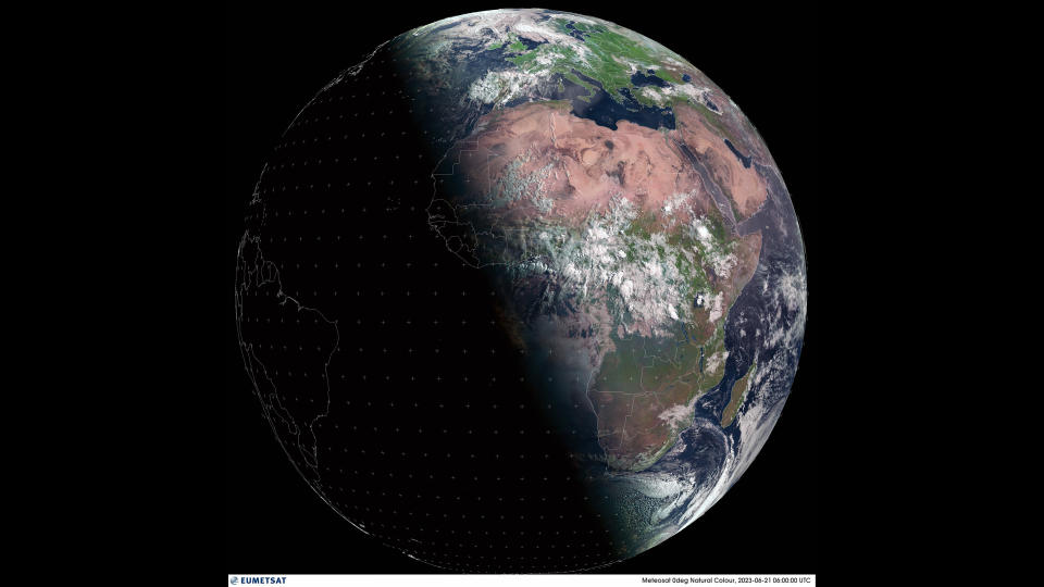 a half-silhouette of earth from space with the other half showing africa and europe in full color