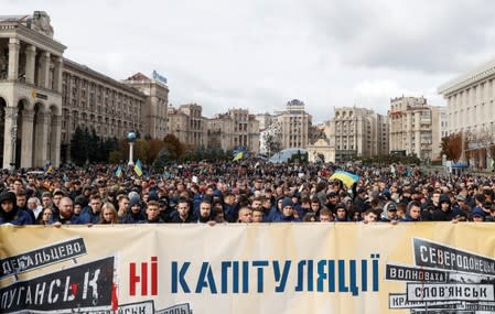 People attend a rally against approval of so-called Steinmeier Formula, in Kiev