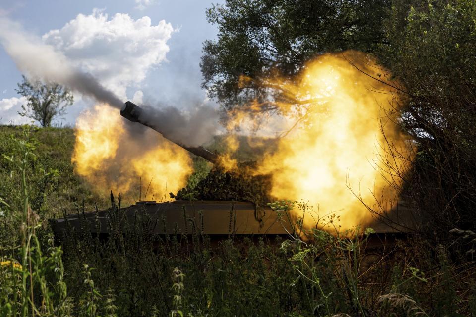 FILE - A Ukrainian self-propelled artillery shoots towards Russian forces at a frontline in Kharkiv region, Ukraine, on July 27, 2022. Even as the Russian war machine crawls across Ukraine’s east, trying to achieve the Kremlin’s goal of securing a full control over the country’s industrial heartland of the Donbas, the Ukrainian forces are scaling up attacks to reclaim territory in the south. (AP Photo/Evgeniy Maloletka, File)