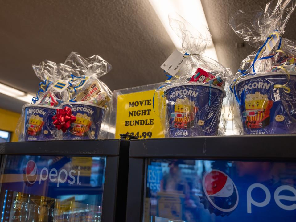 popcorn buckets on top of a fridge in blockbuster