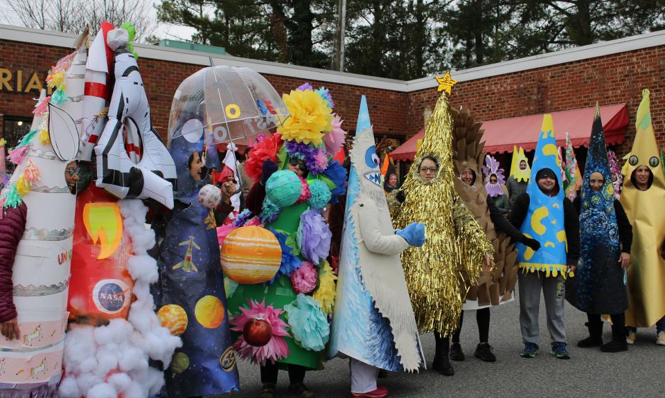 The top 10 adult costumes at the 16th Annual Carytown Cone Parade in Richmond on January 1, 2024. From left to right, Uni-Cone, Rocket-Cone, House of Astrology Cone, Flower Power Cone, Abominable Snow-Cone, Gold Cone-fetti, Pine Cone, Macaconi & Cheese, Starry Night Cone and Dino Cone.