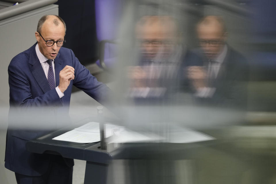 Oposition leader Friederich Merz deliver a speech during a debate about Germany's budget crisis at the parliament Bundestag in Berlin, Germany, Tuesday, Nov. 28, 2023. With its economy already struggling, Germany now is wrestling to find a way out of a budget crisis after a court struck down billions in funding for clean energy projects and help for people facing high energy bills because of Russia's war in Ukraine. (AP Photo/Markus Schreiber)