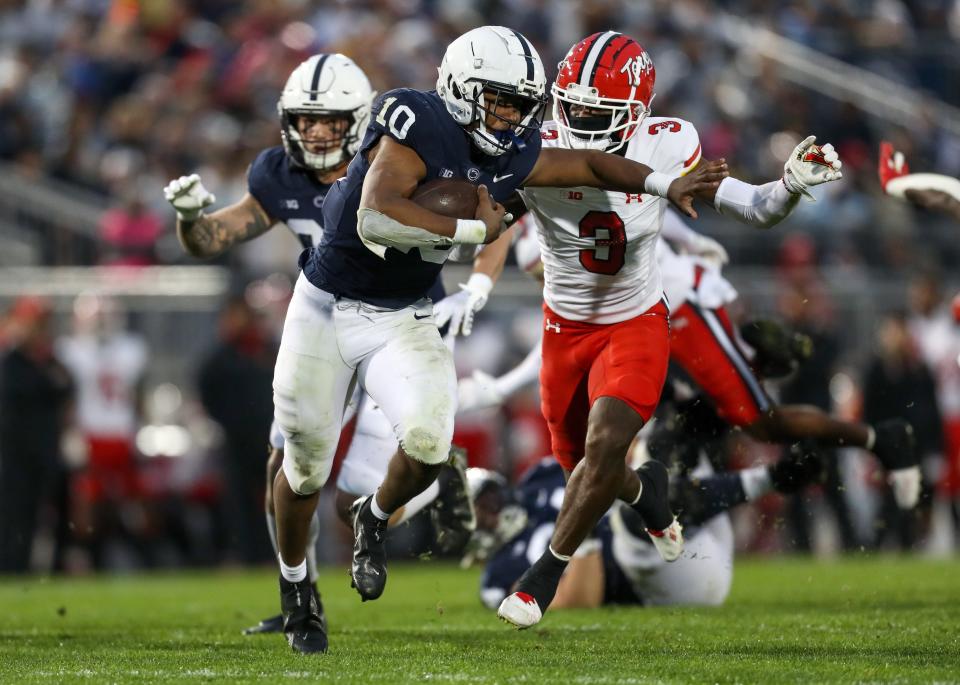 Nov 12, 2022; University Park, Pennsylvania, USA; Penn State Nittany Lions running back Nicholas Singleton (10) breaks a tackle from Maryland Terrapins defensive back Deonte Banks (3) during the second quarter at Beaver Stadium. Penn State defeated Maryland 30-0. Mandatory Credit: Matthew OHaren-USA TODAY Sports