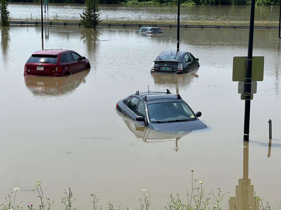 Cars at a park & ride next to I-89 in Richmond are submerged on July 11, 2023.