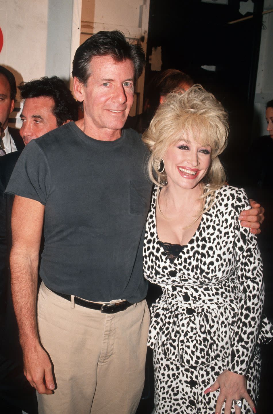 <p>Dolly Parton joins in on Fall Fashion Week fun in 1994 with legendary designer Calvin Klein. </p>