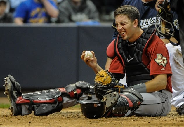 Houston Astros' Jason Castro watches the ball after hitting a two