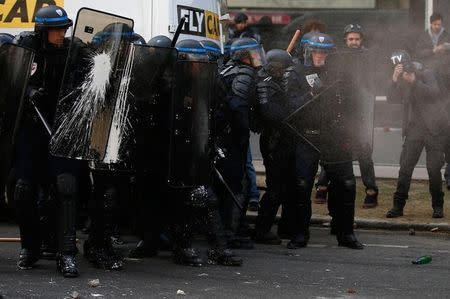 French CRS riot police face off with French high school and university students during a demonstration against the French labour law proposal in Paris, France, April 5, 2016 as the French Parliament will start to examine the contested reform bill. REUTERS/Pascal Rossignol