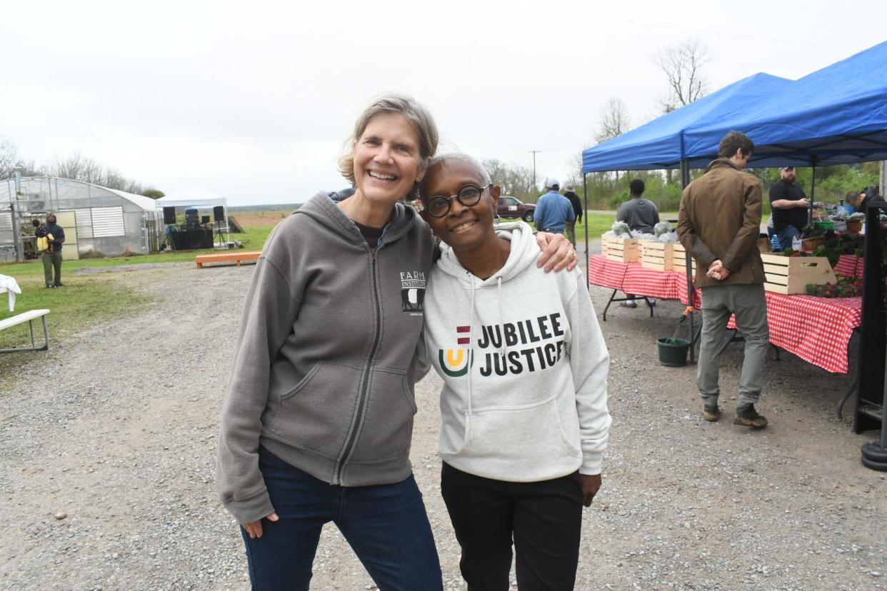 Elisabeth Keller (left) retired president of Inglewood Farm and Konda Mason, president and founder of Jubilee Justice celebrated a new chapter in Inglewood's history. The Keller family transferred ownership of 17 acres to the non-profit that leases land to grow rice. Jubilee Justice has also taken over Inglewood's organic vegetable growing operation.