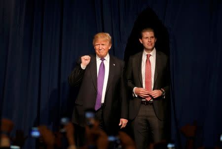 Donald Trump pumps his fist as he arrives arrives with his son Eric to address supporters after being declared by the television networks as the winner of the Nevada Republican caucuses at his caucus night rally in Las Vegas. REUTERS/Jim Young