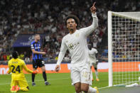 Bayern's Leroy Sane celebrates after Inter Milan's Danilo D'Ambrosio scored an own goal to give Bayern a 2-0 lead, during the Champions League, group C soccer match between Inter Milan and Bayern Munich, at the Milan San Siro stadium, Italy, Wednesday, Sept. 7, 2022. (AP Photo/Luca Bruno)