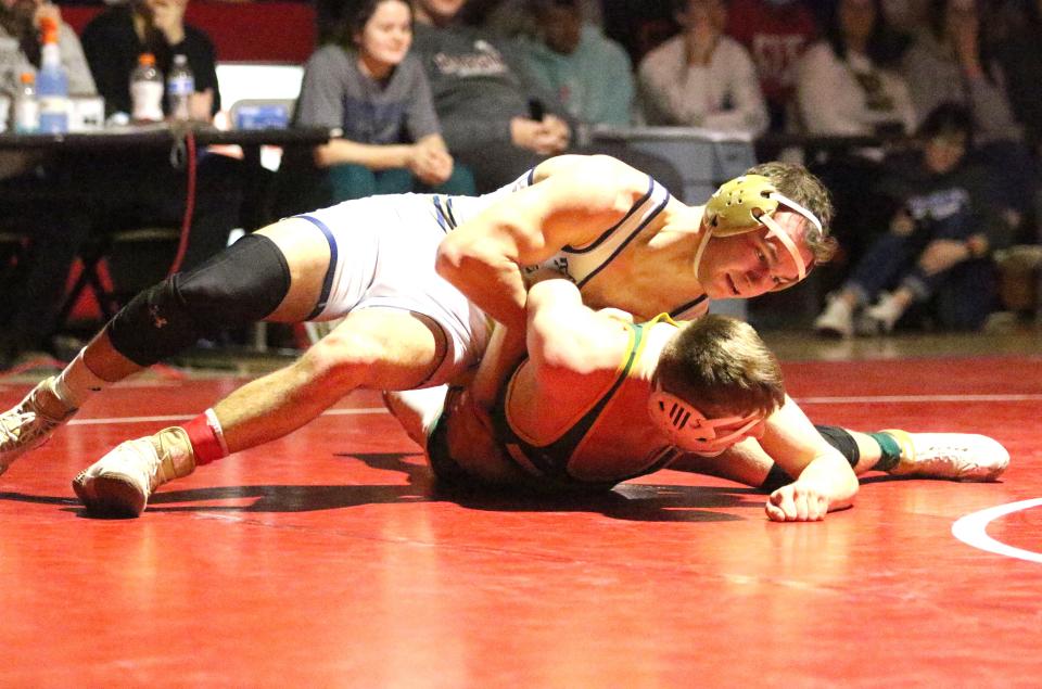 Gill Stawinski of Essex gains control of Burr and Burton's Liam Bradley during the 170 pound final at the State Championships on Sunday night at CVU. Stawinski won the match to claim the 170 pound title.