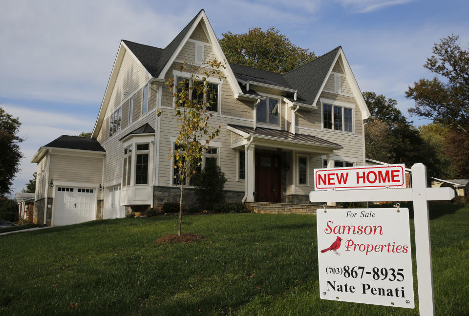 A real estate sign advertising a new home for sale is pictured in Vienna, Virginia, outside of Washington, October 20, 2014.       REUTERS/Larry Downing/File Photo