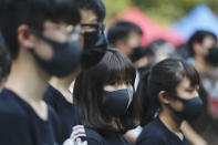 Students gather during a school children's strike event in support of protest movement in Hong Kong Monday, Sept. 30, 2019. Hong Kong authorities Monday rejected an appeal for a major pro-democracy march on National Day’s holiday after two straight days of violent clashes between protesters and police in the semi-autonomous Chinese territory roused fears of more showdowns that would embarrass Beijing. (AP Photo/Gemunu Amarasinghe)