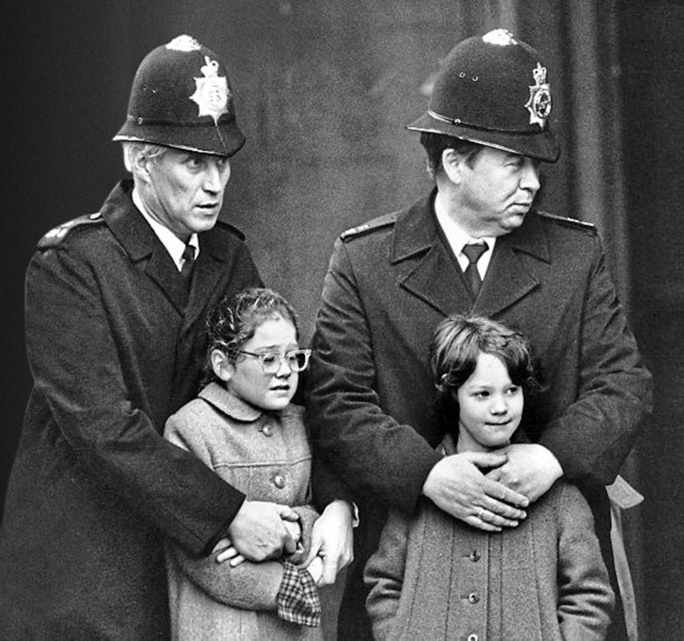 Horror: Melanie and Susanne Dodd at the funeral of their father (Associated Newspapers )