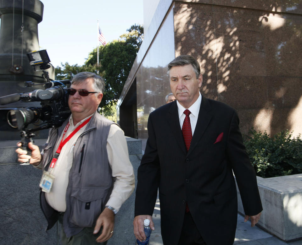 Jamie Spears, right, father of singer Britney Spears, leaves the Stanley Mosk Courthouse Wednesday, Oct. 24, 2012, in Los Angeles. Britney Spears' ex-manager, Sam Lutfi, who is suing Spears' parents for defamation, testified Wednesday while they watched from across the courtroom. (AP Photo/Nick Ut)