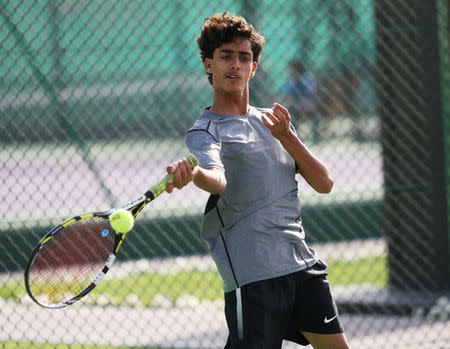 Ammar Saeed from Aden, 13, competes during a tennis match in the Asia under 14 Championship tournament in Doha, Qatar, March 6, 2017. Picture taken March 6, 2017. REUTERS/Naseem Zeitoon