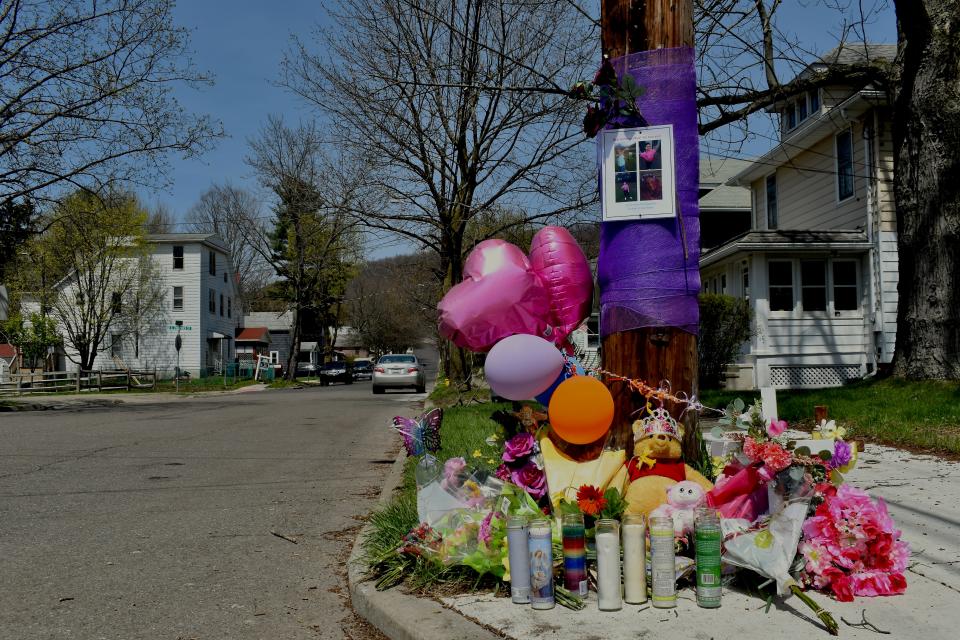 Cards, balloons, candles, flowers and toys comprised a memorial to 12-year-old Aliza Spencer at the corner of Bigelow and Chamberlain streets in the East Side neighborhood where she was shot and killed April 21, 2022.