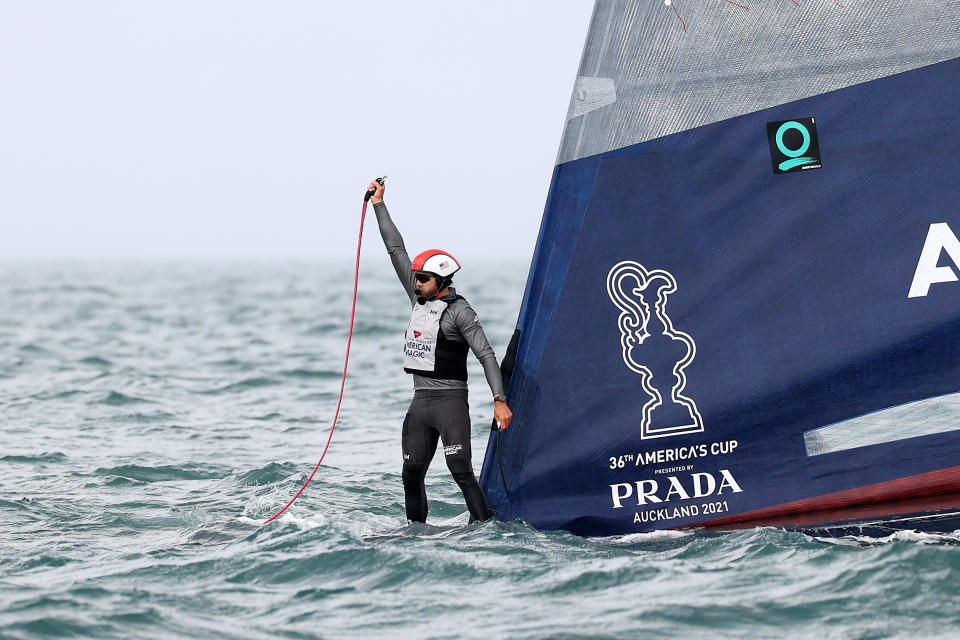 AUCKLAND, NEW ZEALAND - JANUARY 17: An American Magic crew member stands on the bow after the boats capsizes in race two against Prada Luna Rossaduring the 2021 PRADA Cup Round Robins on Auckland Harbour on January 17, 2021 in Auckland, New Zealand. (Photo by Fiona Goodall/Getty Images)