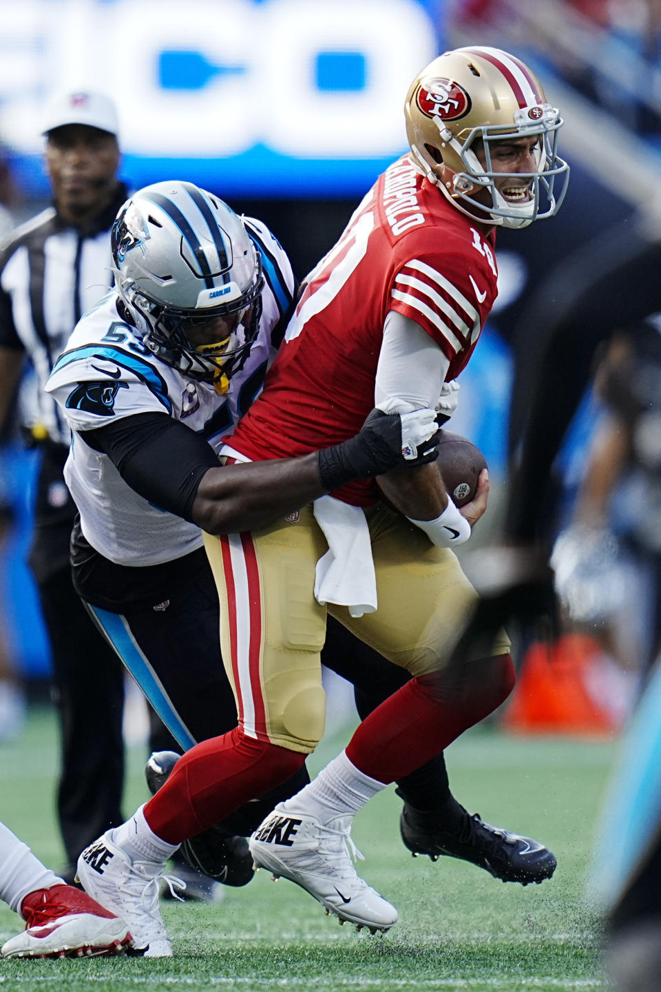 San Francisco 49ers quarterback Jimmy Garoppolo is tackled by Carolina Panthers defensive end Brian Burns during the first half an NFL football game on Sunday, Oct. 9, 2022, in Charlotte, N.C. (AP Photo/Rusty Jones)