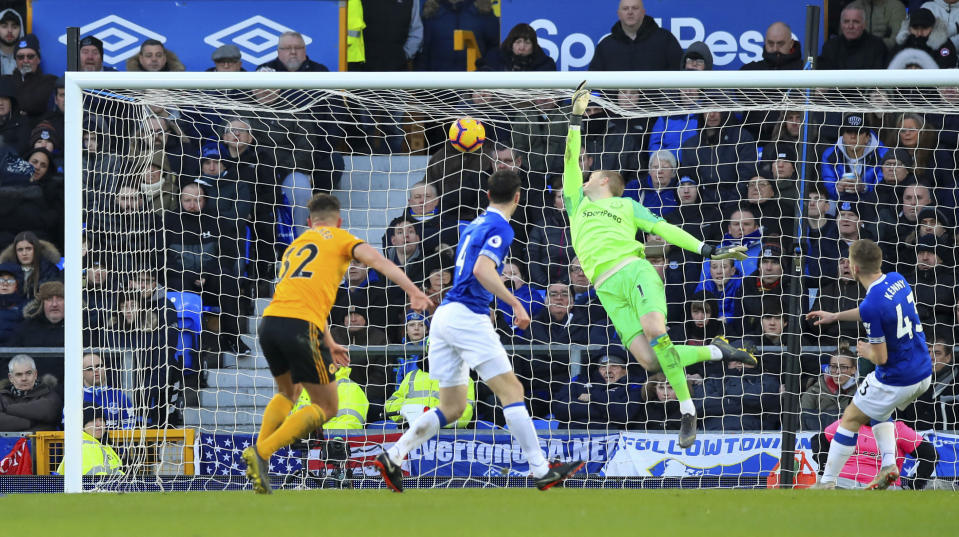 Wolverhampton Wanderers' Leander Dendoncker, left, scores against Everton during the English Premier League soccer match at Goodison Park, Liverpool, England, Saturday Feb. 2, 2019. (Peter Byrne/PA via AP)