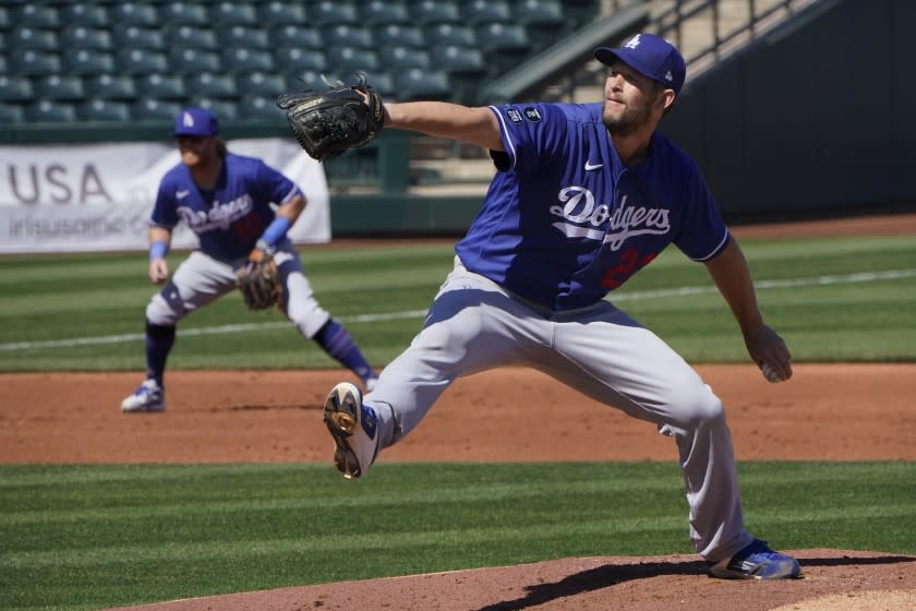 Los Angeles Dodgers' Clayton Kershaw (22) pitches in the first inning of a spring training baseball game.
