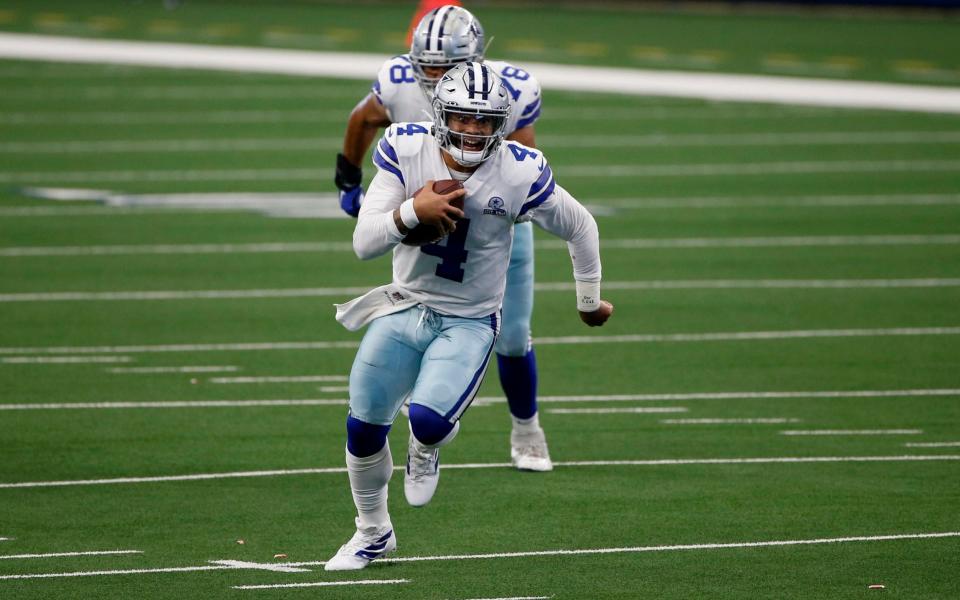 Dallas Cowboys quarterback Dak Prescott (4) finds running room against the Atlanta Falcons in the first half of an NFL football game in Arlington, Texas, Sunday, Sept. 20, 2020. - AP