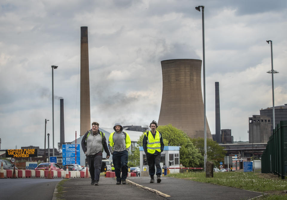 Workers leave the steelworks plant in Scunthorpe following a shift change as owner British Steel is to go into official recievership after failing to secure funds for its future.