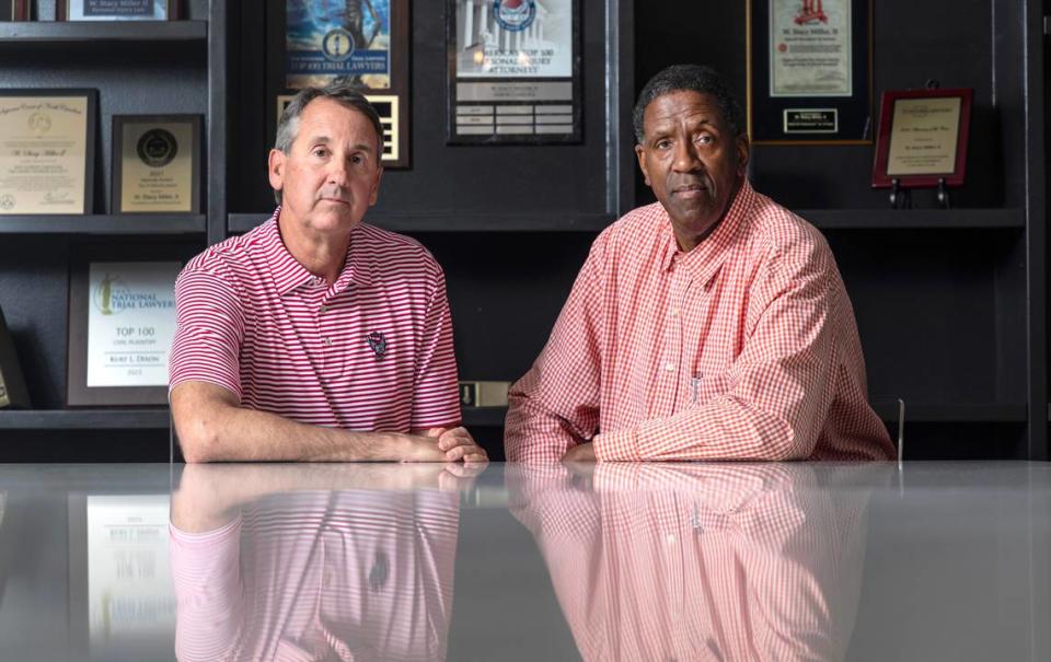 Mike Warren and Cozell McQueen pose at the office of Miller Law Group in Raleigh, N.C., Monday, June 10, 2024. Warren and McQueen are part of a group of players from N.C. State’s 1983 national championship basketball team who are suing the NCAA for using their name, image and likeness without their permission or providing compensation, citing the 2021 Supreme Court antitrust case against the governing body.