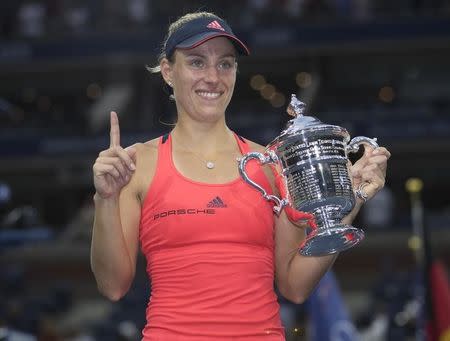 Sep 10, 2016; New York, NY, USA; Angelique Kerber (GER) poses with the trophy after her match against Karolina Pliskova (CZE) on day thirteen of the 2016 U.S. Open tennis tournament at USTA Billie Jean King National Tennis Center. Mandatory Credit: Susan Mullane-USA TODAY Sports