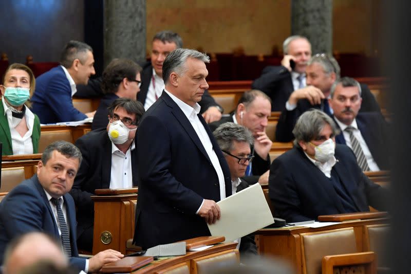 Hungarian Prime Minister Viktor Orban arrives to attend the plenary session of the Parliament ahead of a vote to grant the government special powers to combat the coronavirus disease (COVID-19) crisis in Budapest