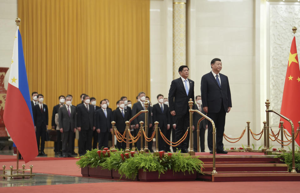 In this photo provided by the Philippines Office of the Press Secretary, Philippine President Ferdinand Marcos Jr., left, and President Xi Jinping stand during a welcome ceremony at the Great Hall of the People in Beijing, Wednesday, Jan. 4, 2023. Marcos is pushing for closer economic ties on a visit to China that seeks to sidestep territorial disputes in the South China Sea. (Philippines Office of the Press Secretary via AP)