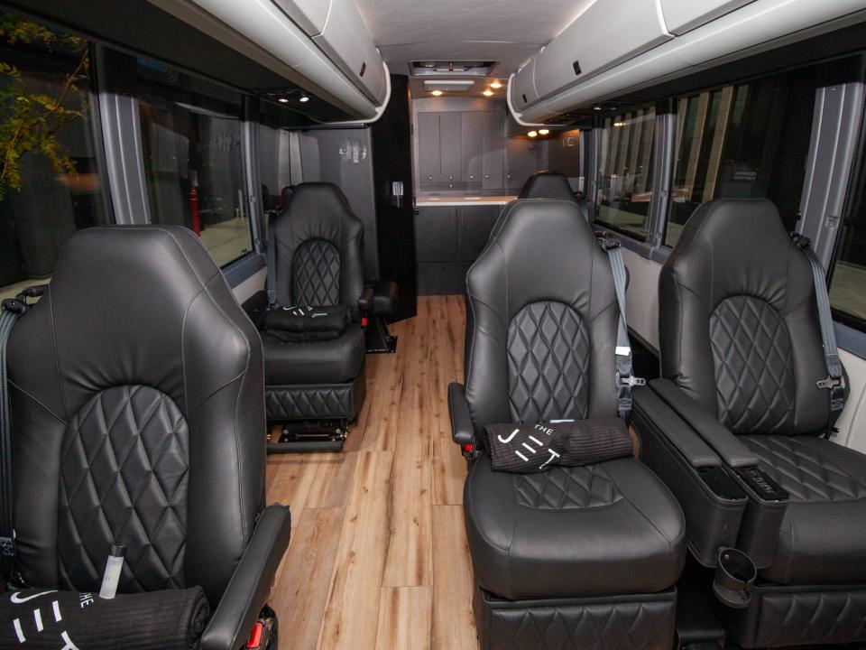 rows of seats inside one of the Jet's buses