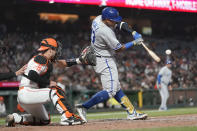 Kansas City Royals' Salvador Perez hits an RBI single in front of San Francisco Giants catcher Austin Wynns during the eighth inning of a baseball game in San Francisco, Tuesday, June 14, 2022. (AP Photo/Jeff Chiu)