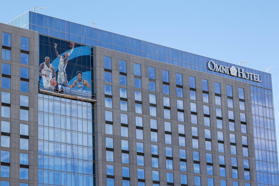 OKC Thunder banners are hung on the Omni Hotel in April ahead of the NBA playoffs in Oklahoma City.