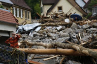 <p>A woman reacts as she looks at the damage on May 30, 2016, that was caused by flooding in Braunsbach, Germany. (Kai Pfaffenbach/Reuters) </p>