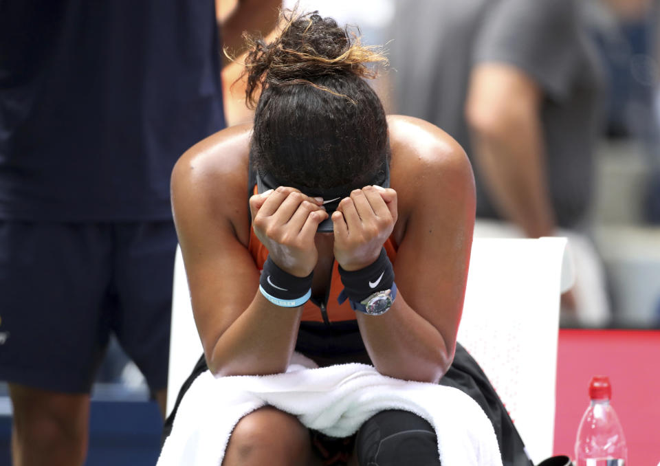 Naomi Osaka, of Japan, reacts after losing the second set to Anna Blinkova, of Russia, during the first round of the US Open tennis tournament Tuesday, Aug. 27, 2019, in New York. (AP Photo/Michael Owens)