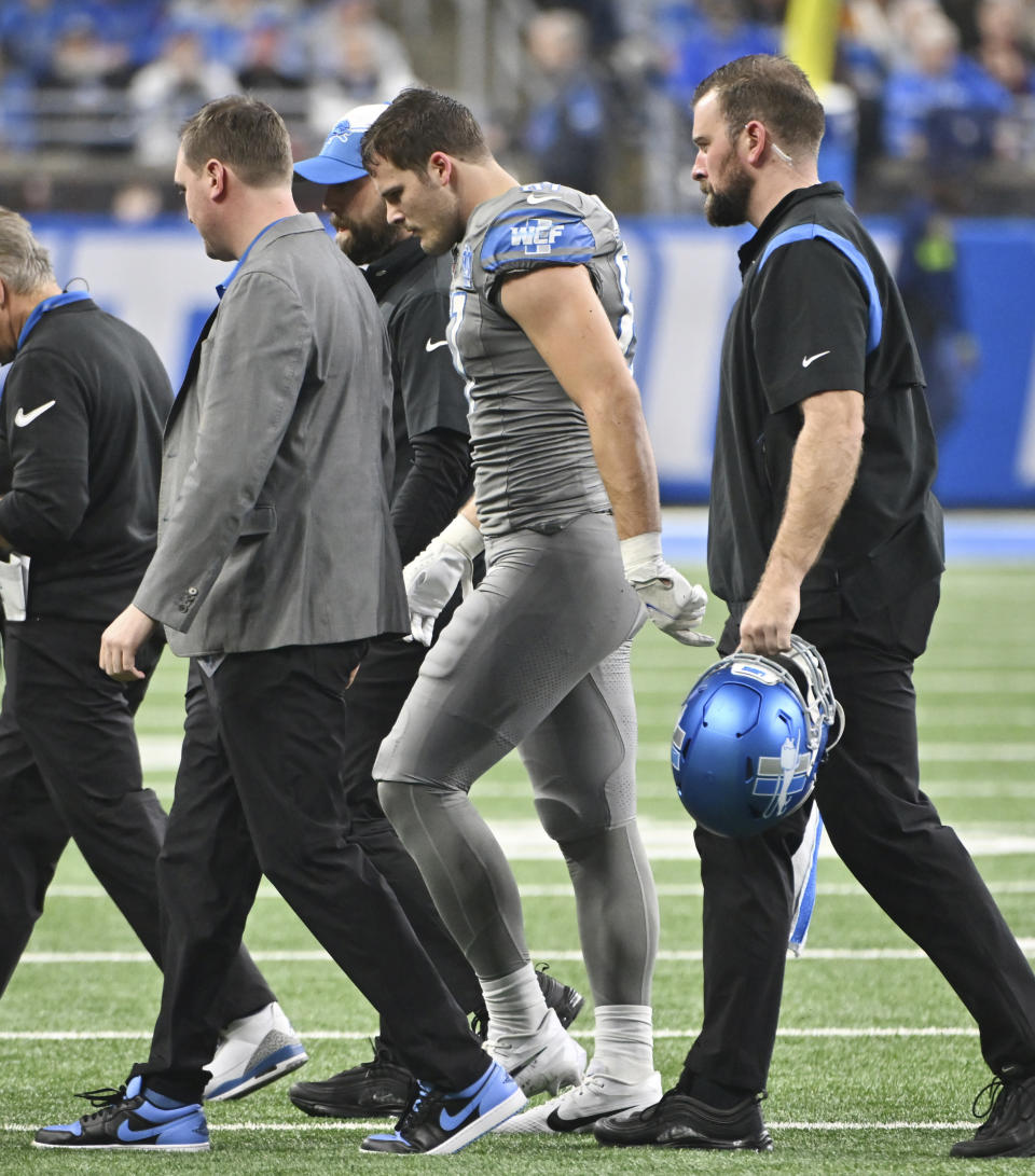 Detroit Lions tight end Sam LaPorta, center, walks off the field during the second half of an NFL football game against the Minnesota Vikings, Sunday, Jan. 7, 2024, in Detroit. (Dan Mears/Detroit News via AP)