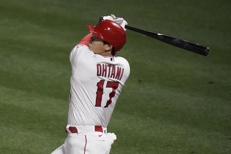 Los Angeles Angels' Shohei Ohtani, of Japan, watches his double during the fifth inning of a baseball game against the Los Angeles Dodgers, Friday, May 7, 2021, in Anaheim, Calif. (AP Photo/Jae C. Hong)