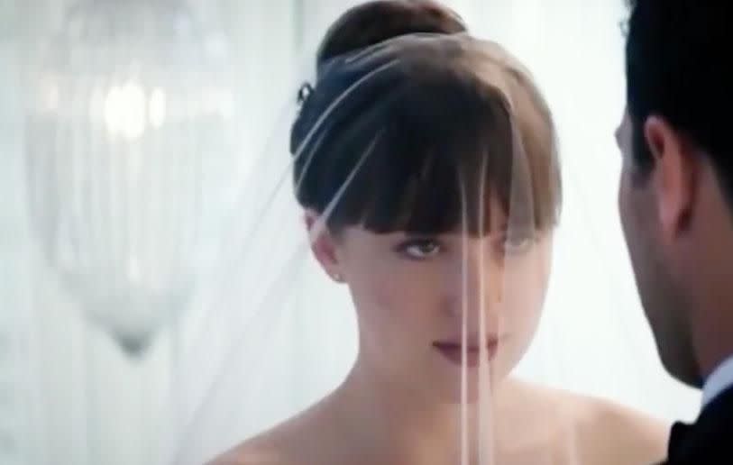 Things are certainly getting serious for the pair, as Dakota is seen wearing a wedding dress and veil. Source: Universal