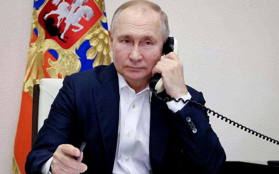 Russian President Vladimir Putin talks on the phone - MIKHAIL KLIMENTYEV/SPUTNIK/AFP via Getty Images