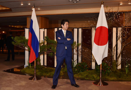 Japanese Prime Minister Shinzo Abe waits for Russian President Vladimir Putin's arrival at a hotel prior to their talks in Nagato, Yamaguchi prefecture on December 15, 2016. REUTERS/ Kazuhiro Nogi/Pool