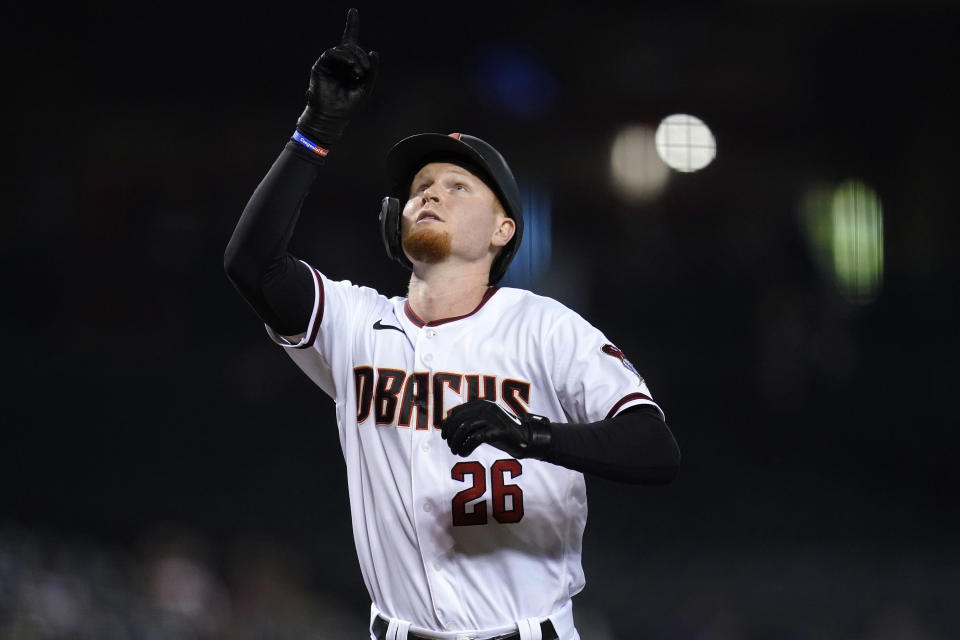 Arizona Diamondbacks' Pavin Smith celebrates his home run against the San Francisco Giants during the fifth inning of a baseball game Thursday, July 1, 2021, in Phoenix. (AP Photo/Ross D. Franklin)