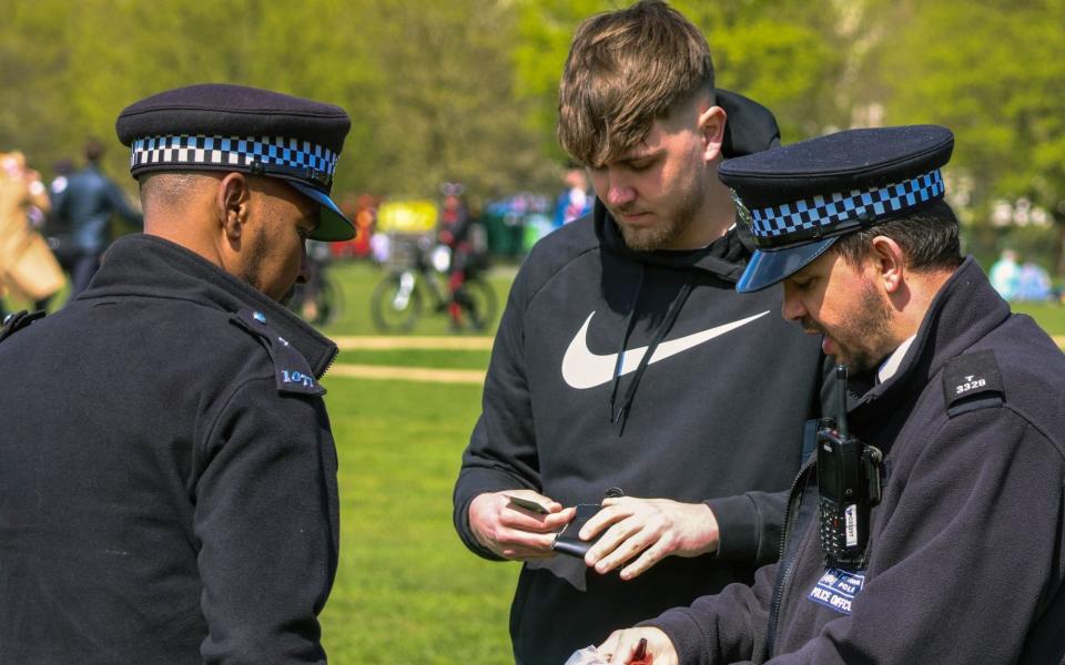 Police talk to a member of the public at the 420 event - Martyn Wheatley/i-Images