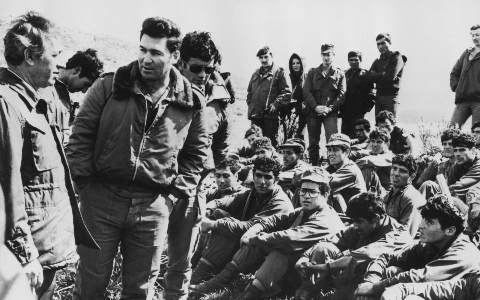 Israeli defence minister Shimon Peres (left) and Major Dan Shomron (second left) after Operation Entebbe, where Israeli paratroops successfully rescued 100 hostages held in Uganda