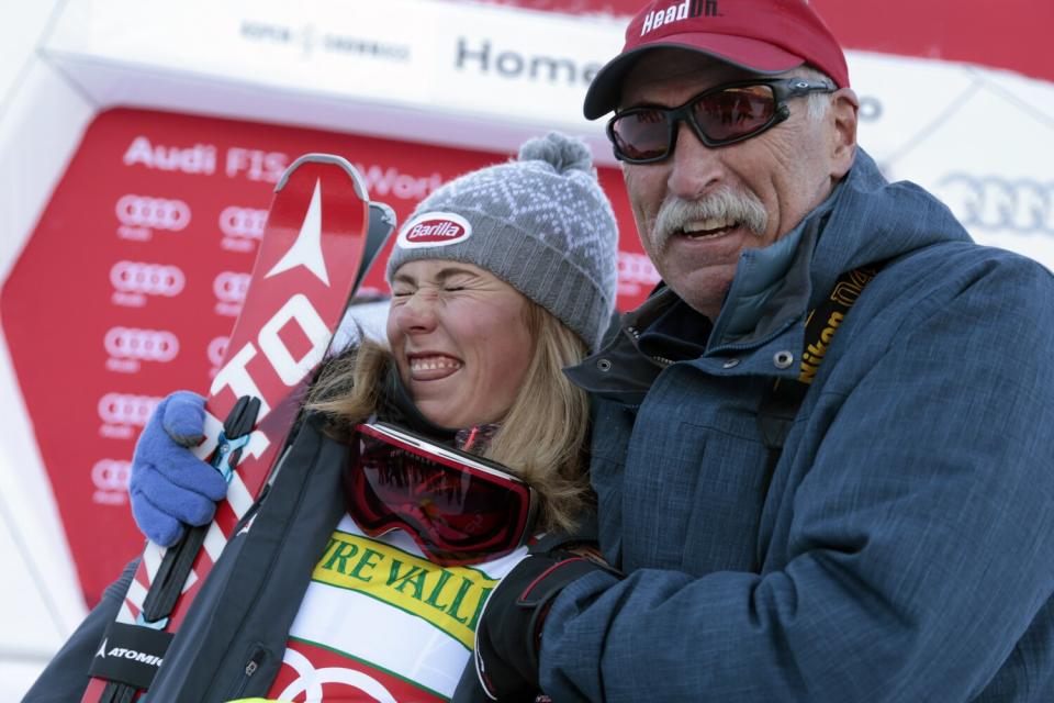 Mikaela Shiffrin makes a playful face as she stands with her father, Jeff, after a 2015 race.