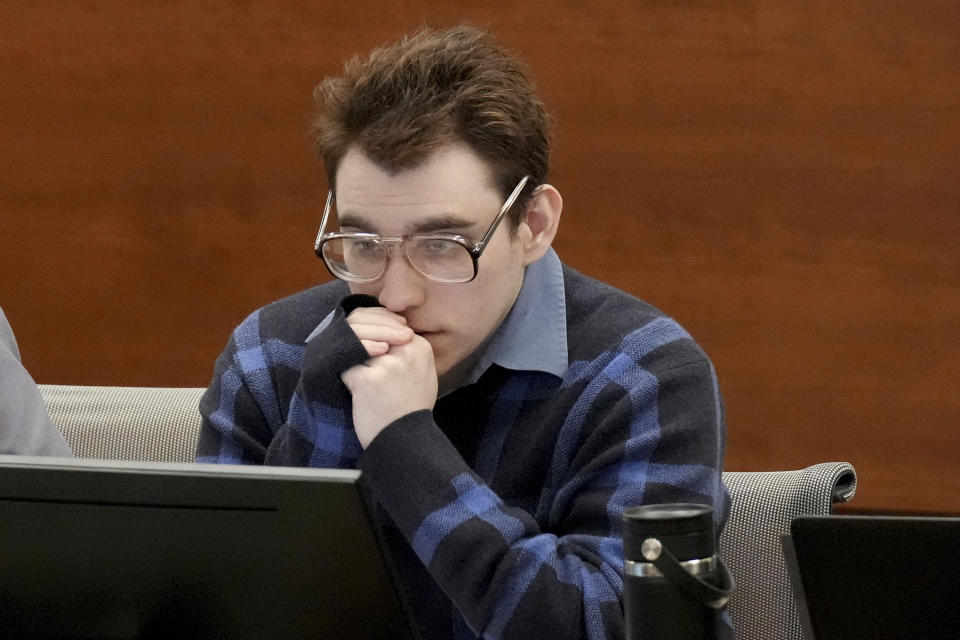Marjory Stoneman Douglas High School shooter Nikolas Cruz is shown at the defense table during the penalty phase of Cruz's trial at the Broward County Courthouse in Fort Lauderdale, Fla., Monday, Aug. 29, 2022. Cruz previously plead guilty to all 17 counts of premeditated murder and 17 counts of attempted murder in the 2018 shootings. (Amy Beth Bennett/South Florida Sun Sentinel via AP, Pool)